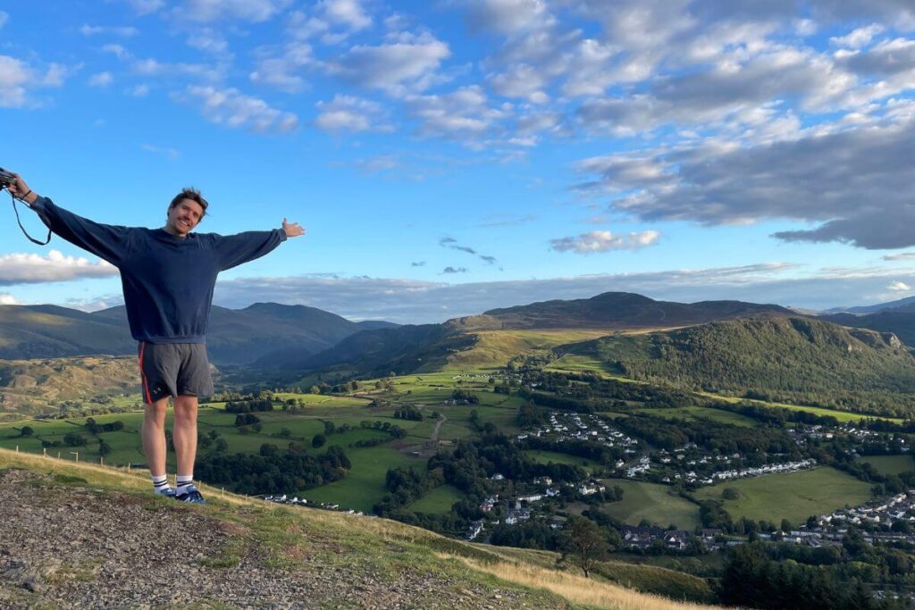Tom enjoying the Latrigg views! Mountains and Keswick in the background