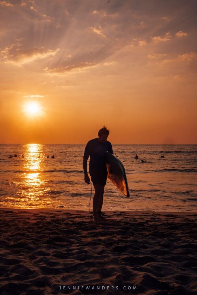 silhoette of surfing at sunset